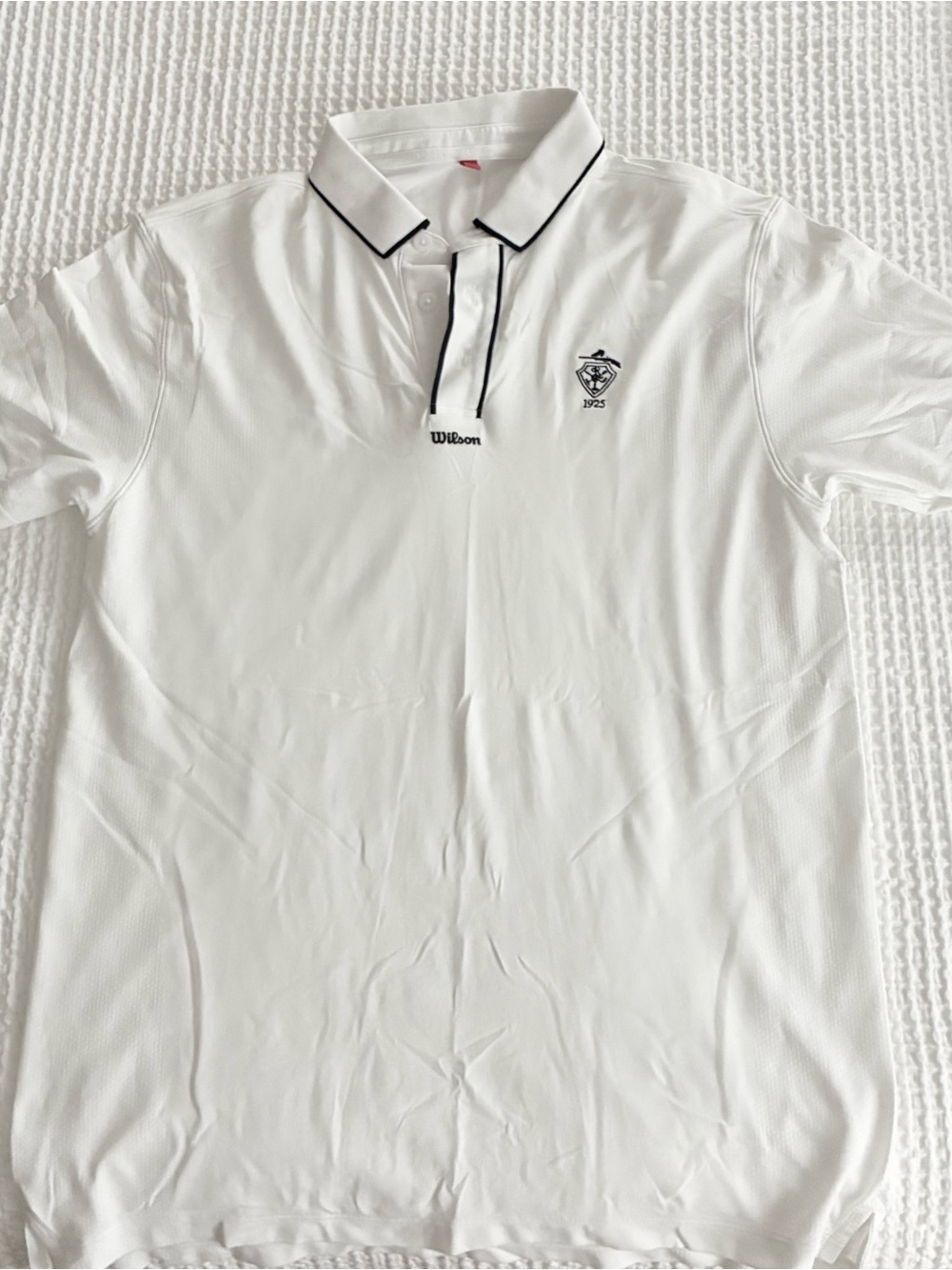 Wilson Men’s White Polo with Black Trim and Embroidered Crest